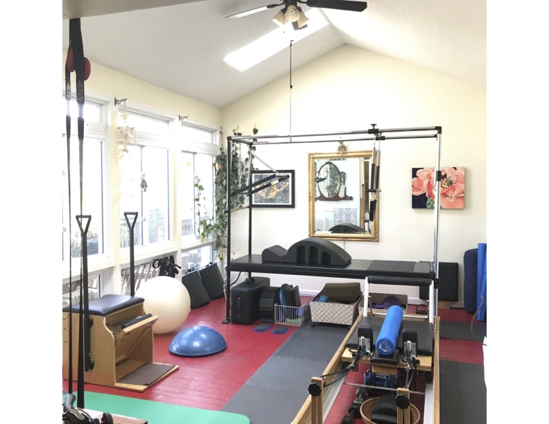 The studio with reformers, a cadillac frame and exercise balls